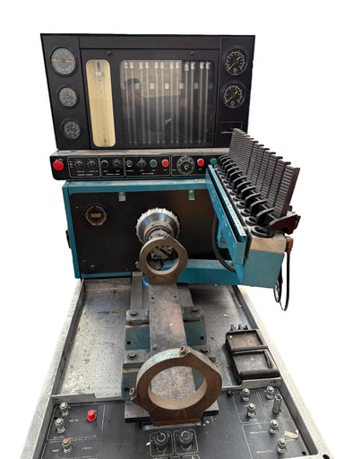 Vintage machine tool with control panel and workpiece on a white background